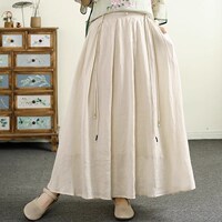千秋飛燕國(guó)風(fēng)流蘇盤扣純色苧麻半身裙女夏季新款寬松高端氣質(zhì)長(zhǎng)裙