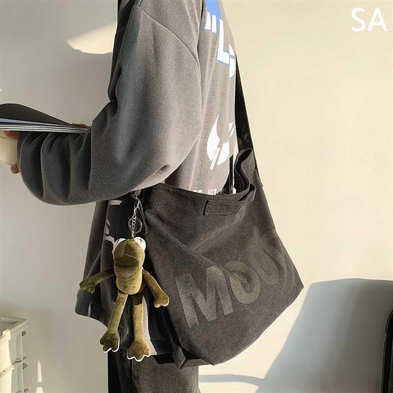 帆布包男斜挎包大容量日系男生z斜女背包跨邮休闲差学生男士单新