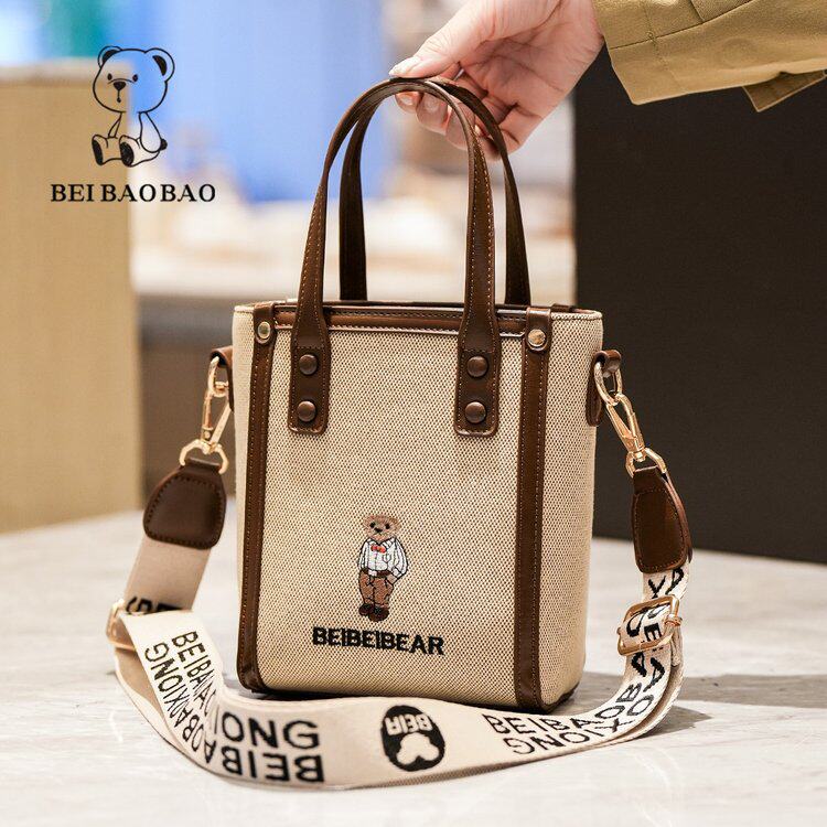 2026新款手机包潮时尚休闲小熊帆布水桶包女百搭单肩斜挎包小包包