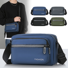 斜挎包男款包包男士单肩包新款大容量休闲防水旅行布包横款小背包