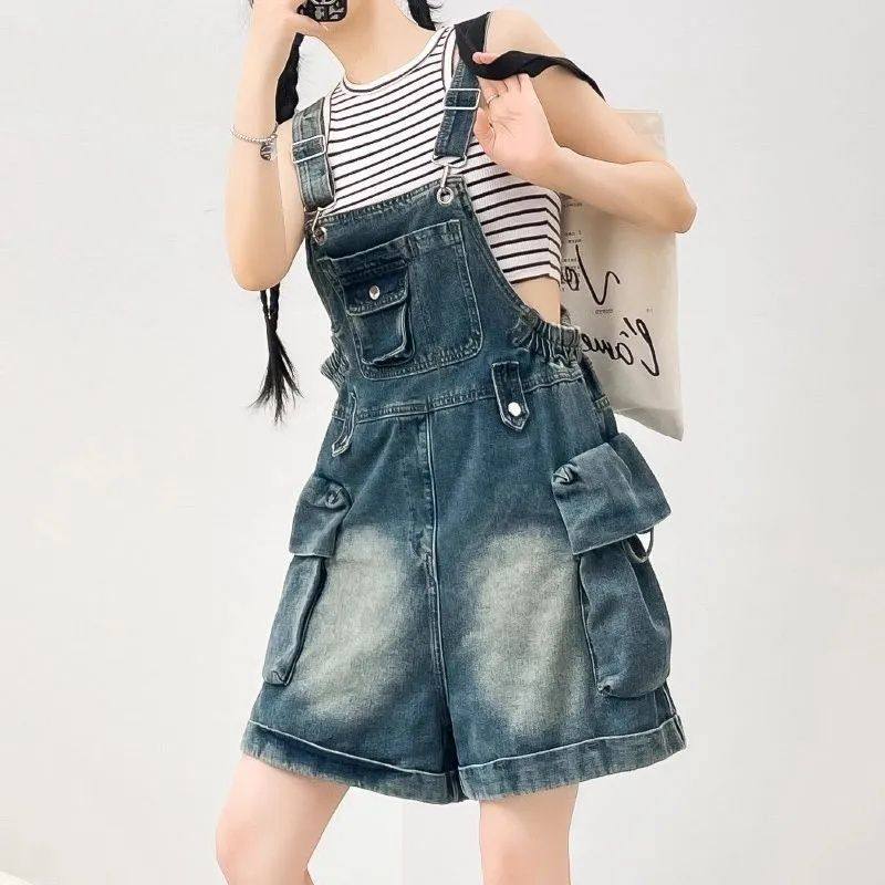 夏季新款复古工装风牛仔背带裤女时尚减龄设计感宽松阔腿连体短裤