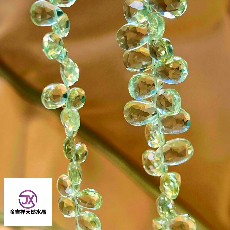 印度进口天然绿水晶扁水滴切面图片