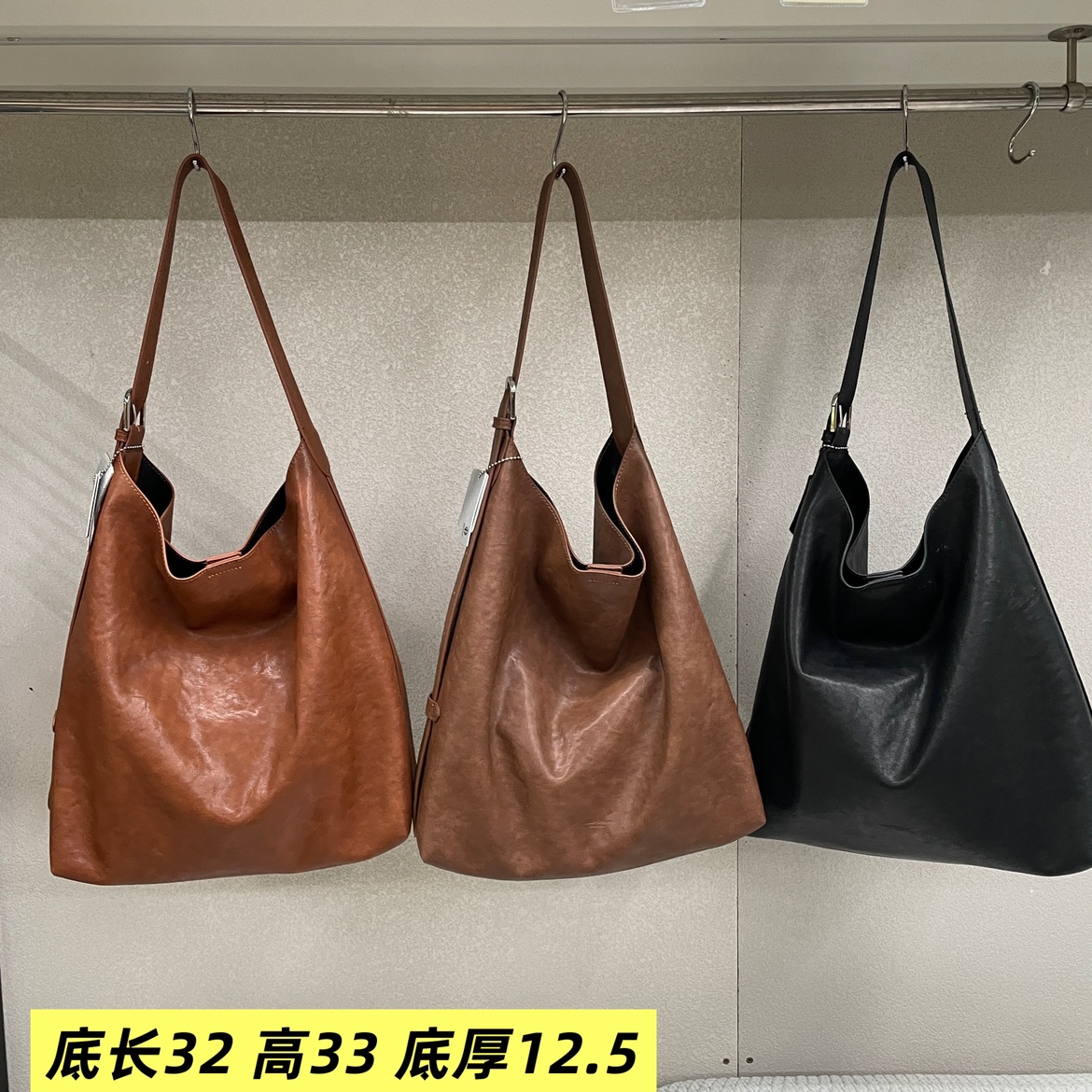 植鞣真皮休闲水桶女包2025新款时尚欧美气质宽带慵懒韩版斜挎包