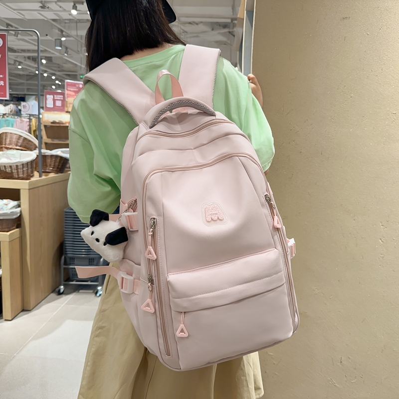 韩版简约纯色百搭初中生书包女小学生轻便减负减压背包休闲双肩包