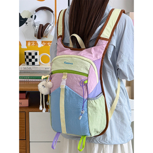 多巴胺撞色小众运动轻便书包学生防水双肩包户外徒步登山旅行背包
