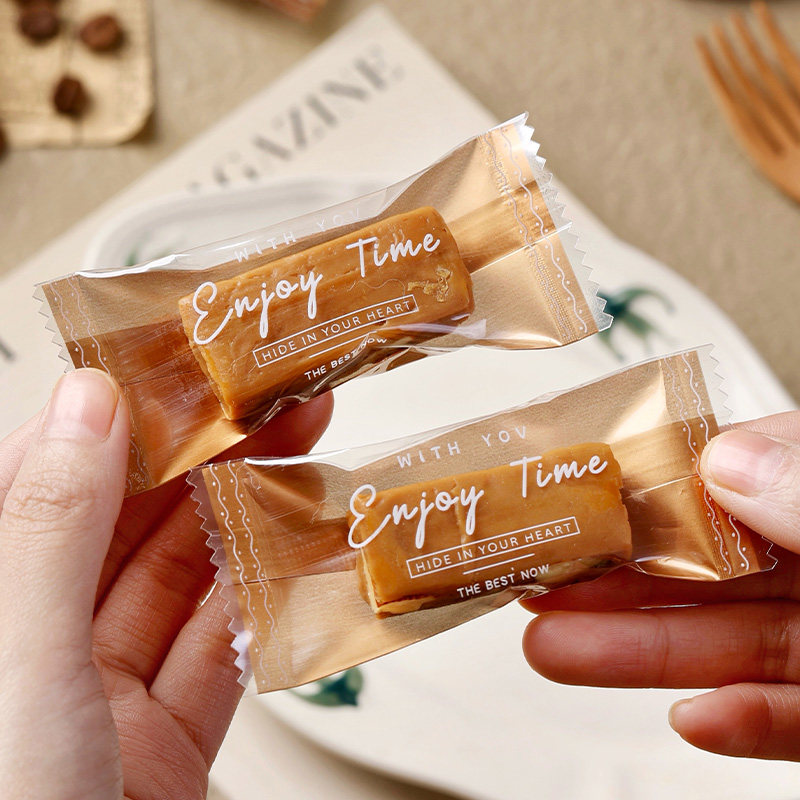 2026太妃糖包装袋过年高档加厚金色英文牛轧海盐杏仁咖啡糖机封袋
