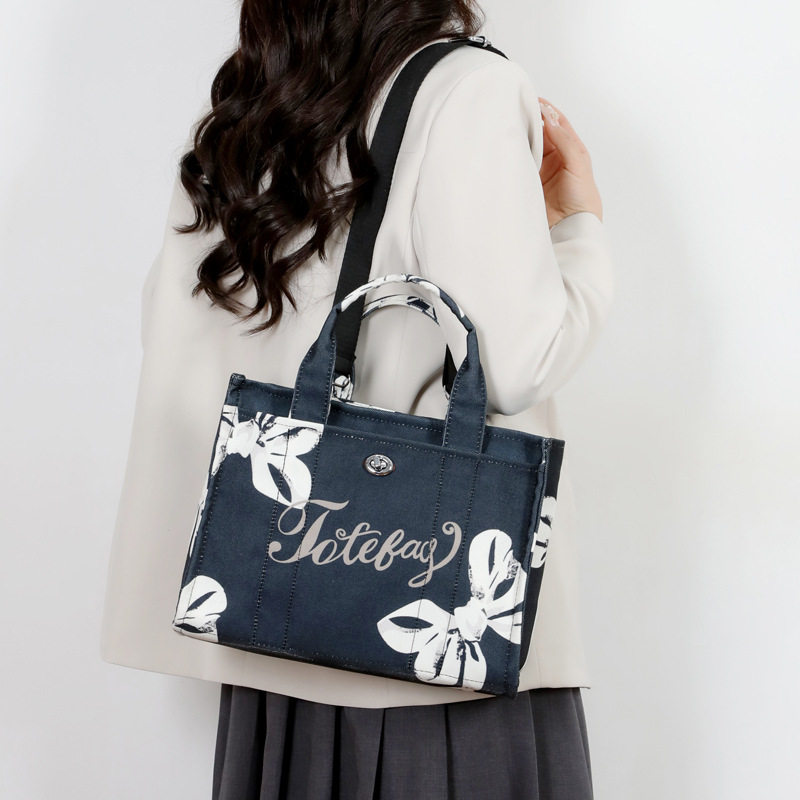 休闲樱桃花手提包潮女外贸牛货女包特价尾货清仓帆布包公文斜挎包