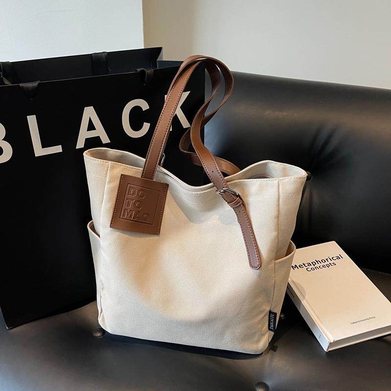 大容量帆布包包女2025新款休闲学生单肩手提袋简约百搭通勤托特包