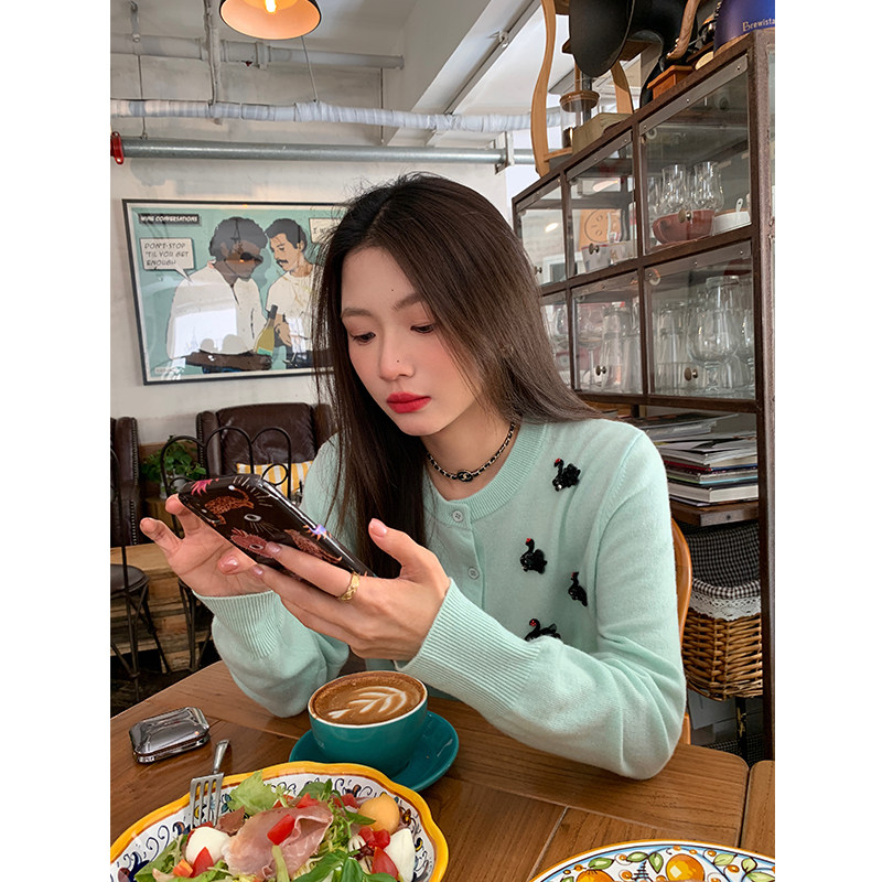 落落狷介绵羊毛针织衫女图片