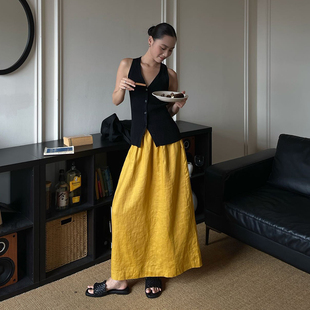 小众简约橘黄色亚麻休闲2025夏季女半身裙松紧腰百搭中长款半裙