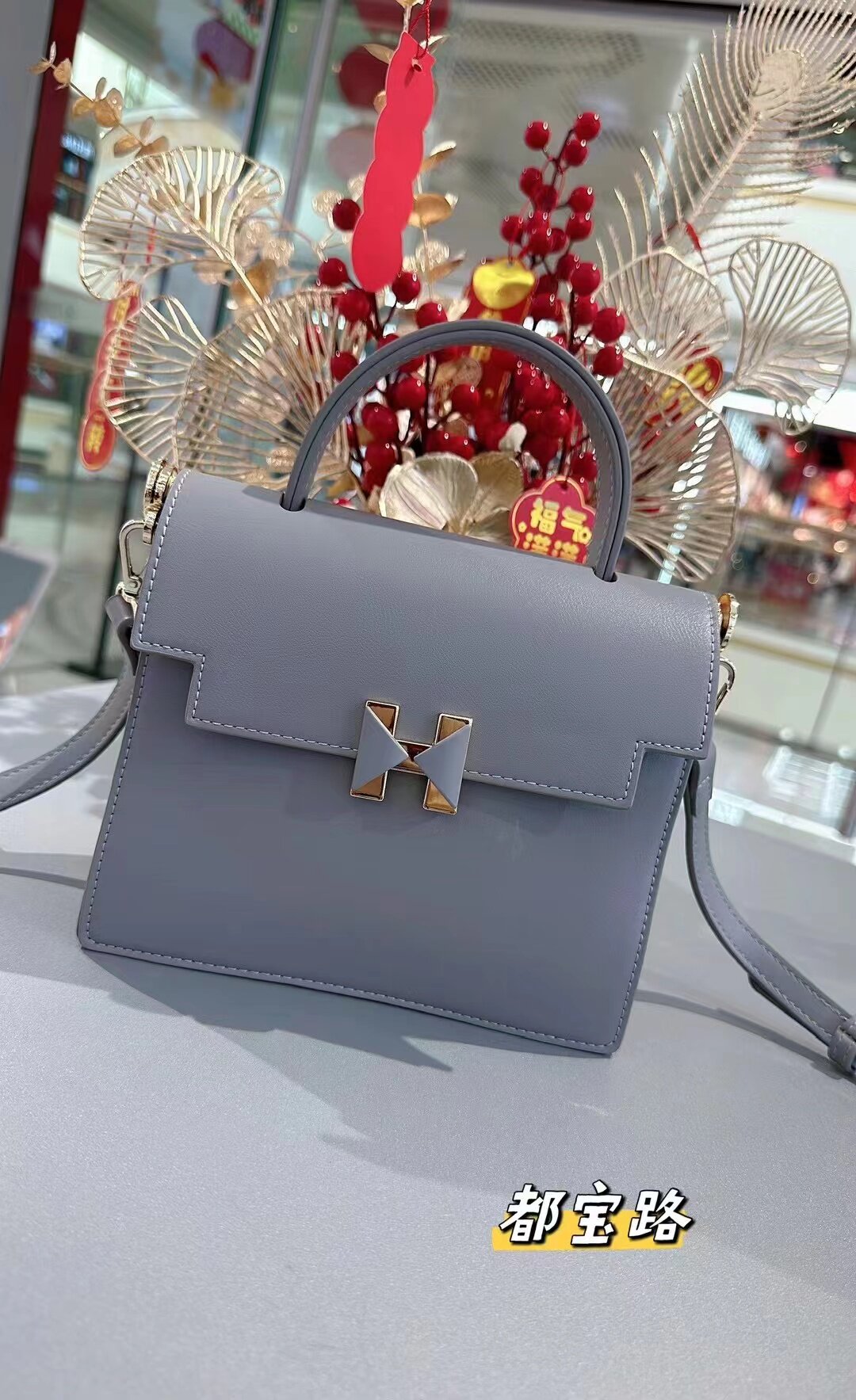 都宝路女包商场同款2025春款上新单肩斜挎包时尚轻奢邮差包水桶包