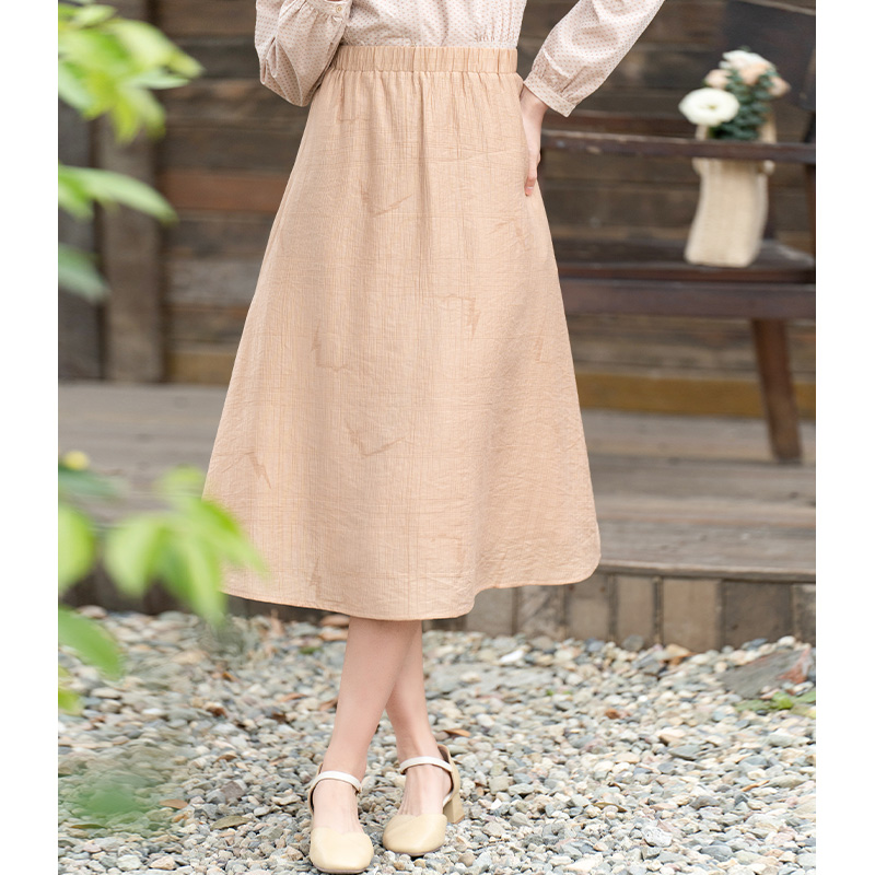 纻衣卡其色文艺半身裙女2025春装新款修身松紧腰百搭显瘦中长裙子
