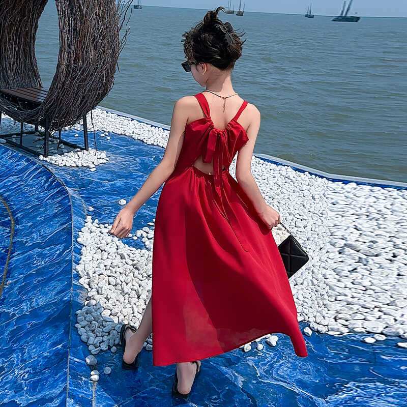 女童海边度假红色吊带连衣裙2025新款法式高级露背绑带沙滩长裙
