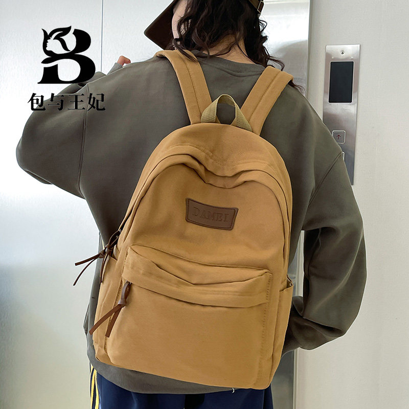 日系ins风水洗帆布双肩包 小众背包纯色美式复古大学生高中书包女