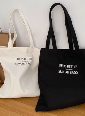 文艺字母大容量单肩帆布包包男女学生上课手提书包袋韩风小众设计