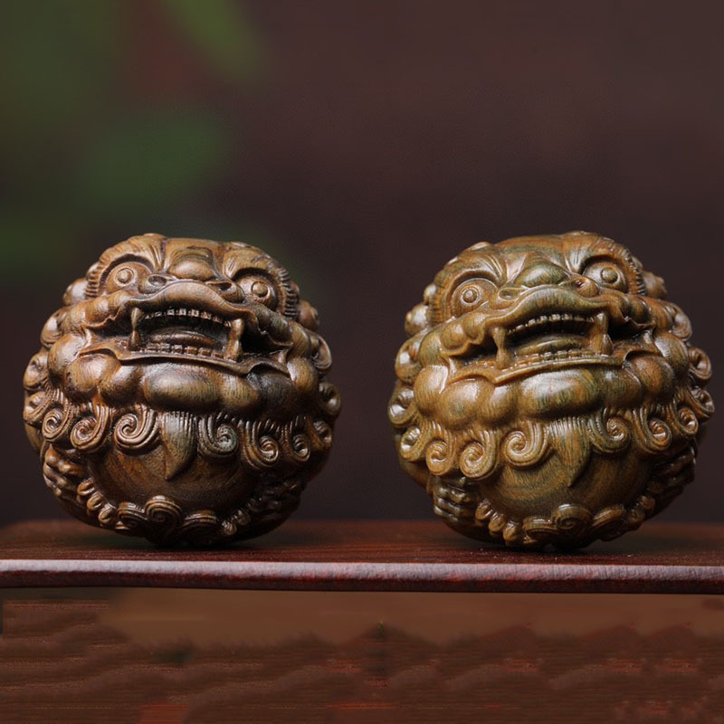 福瑞堂绿檀木雕刻狮子头手球把件