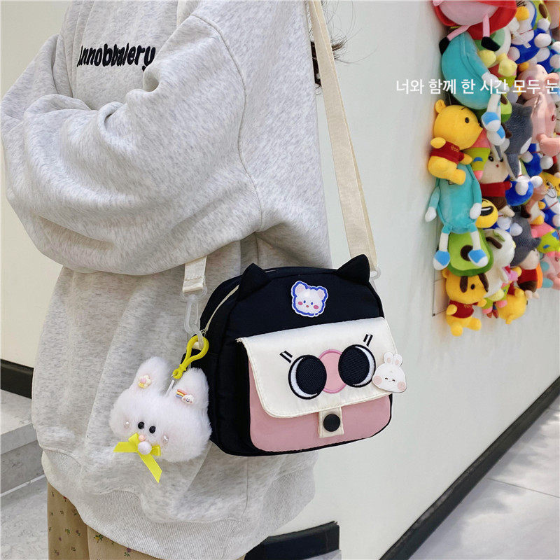 可爱猫咪女孩子斜挎包包新款中大童单肩包女生轻便休闲手机零钱包