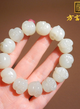 新疆且末料羊脂白玉精雕佛头手串