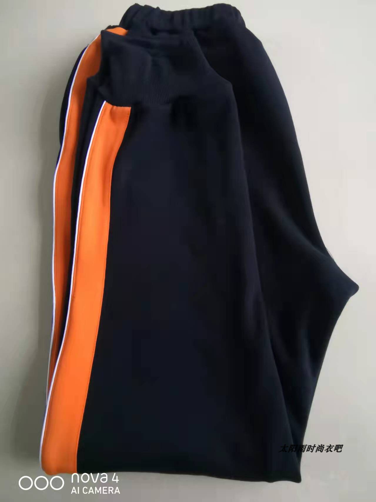 THE NEW SPRING AND AUTUMN SCHOOL UNIFORM PANTS ARE WIDE ORANGE AND THIN WHITE A CUFF OF JUNIOR HIGH SCHOOL AND PRIMARY SCHOOL BOYS AND WOMENS SWEATPANTS