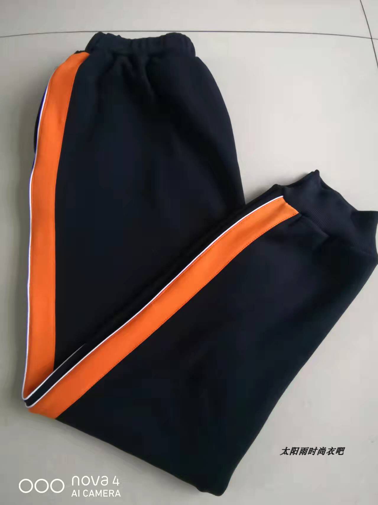 THE NEW SPRING AND AUTUMN SCHOOL UNIFORM PANTS ARE WIDE ORANGE AND THIN WHITE A CUFF OF JUNIOR HIGH SCHOOL AND PRIMARY SCHOOL BOYS AND WOMENS SWEATPANTS