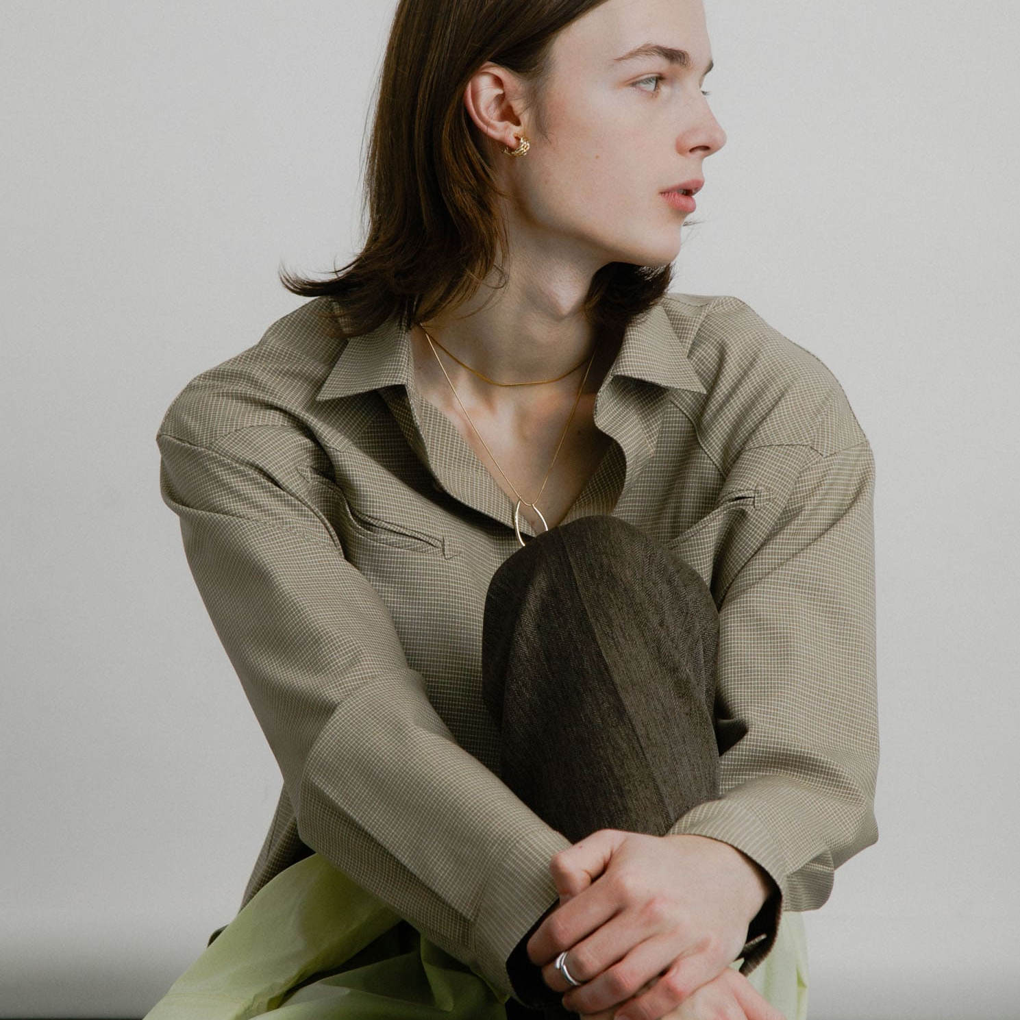 宽松翻领系扣箭头口袋格子衬衫