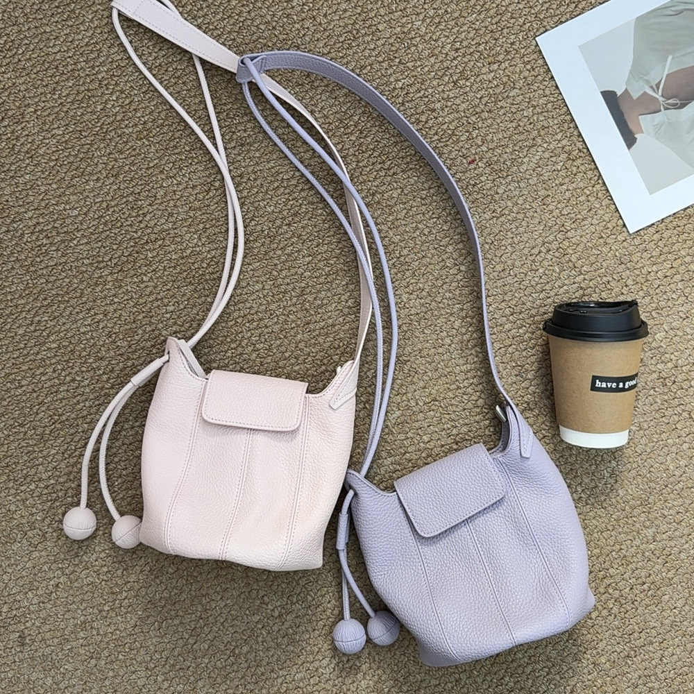 TANGFEEL复古水桶包女2026新款潮ins风斜挎单肩包真皮头层牛皮包