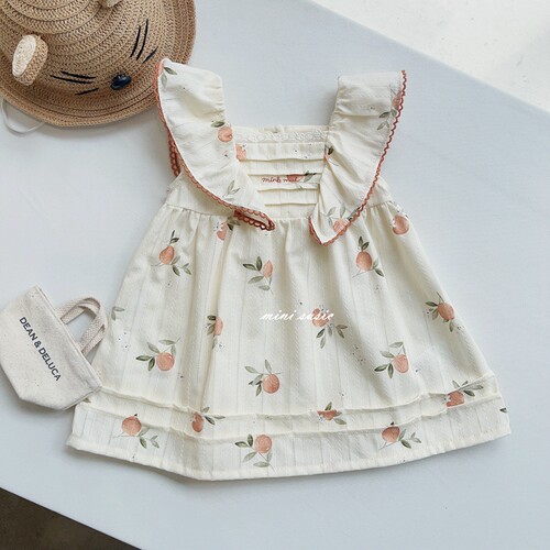 米黄底满印花朵连衣裙