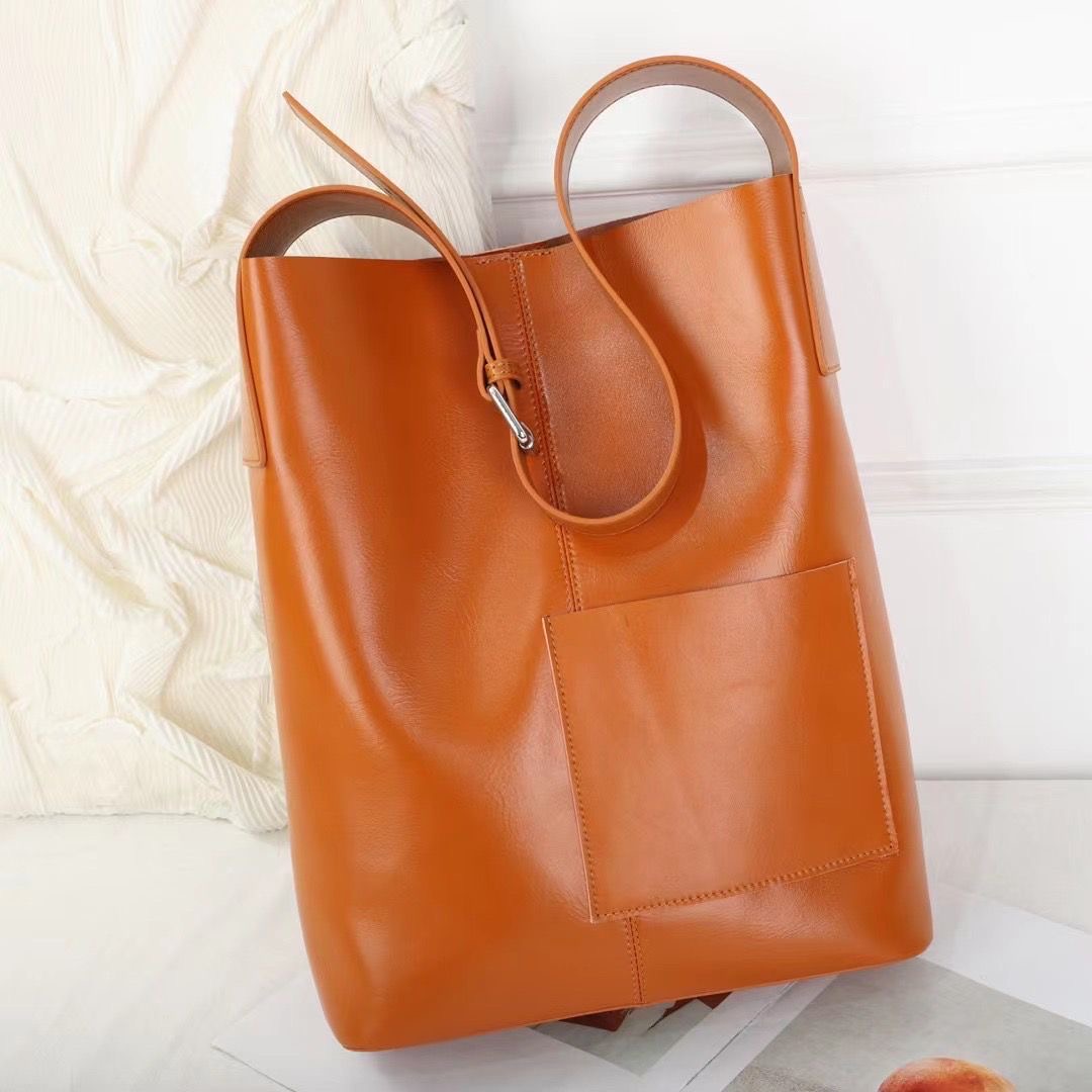 单肩包真皮新款托特包简约女包竖款水桶包通勤时尚大容量包宽肩带