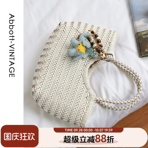 牛皮编织手提斜挎度假包菜篮包