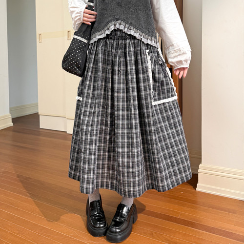 森女部落甜美风拼接设计感格子半身裙女2026新款大裙摆A字裙冬季