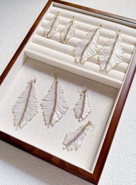 波光粼粼新款白色羽毛串珠流苏耳环女轻奢小众设计感仙气百搭耳饰
