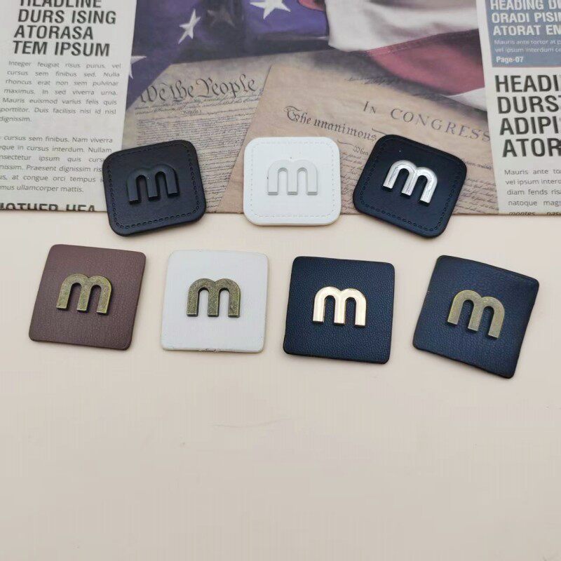 皮标皮牌金属M字母包包衣服补丁纽扣