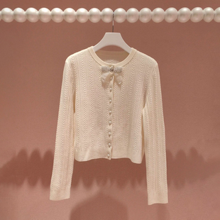 深圳南油高端女装2026春季新款甜美淑女风蝴蝶结珍珠扣针织开衫女