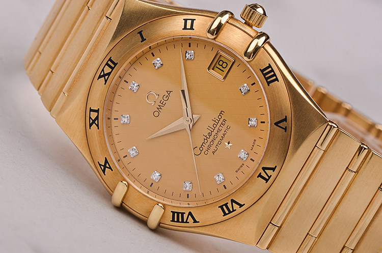 【98新】欧米茄星座全黄金刻度钻大三针日历自动男表1102.15.00