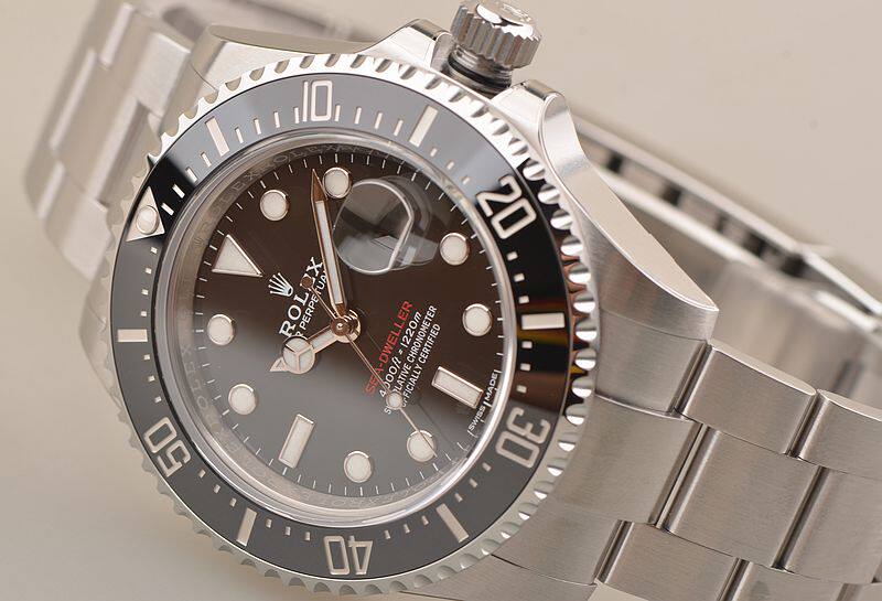 已售出【未使用品】劳力士新海使单红1220米黑盘陶瓷圈钢带男表126600