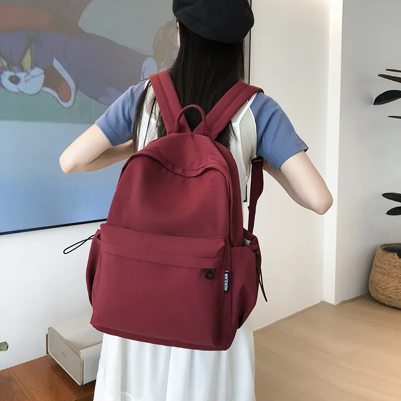 日系初中书包女大简约轻便旅行背包男高中生设计大容量双肩包