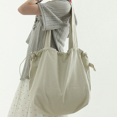 glossy leather string shoulder bag