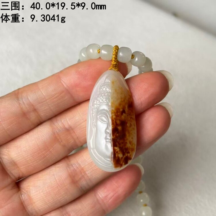 “一念之间”红沁皮白玉籽料挂件