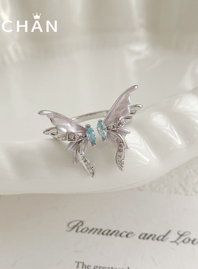 精致浅粉滴油蝴蝶戒指女气质时尚日韩镶浅海蓝锆石开口可调节手饰