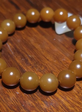 YQ121903 26.7克，10mm油糯细润色泽浓郁且末老红糖玉圆珠手串