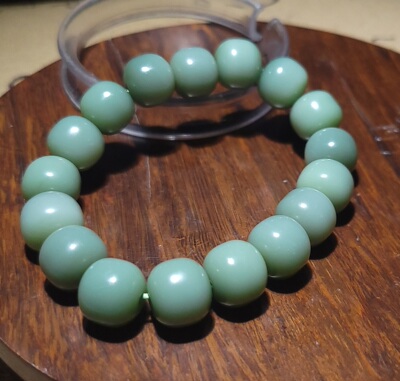 YQ123006 45.0克直径11-10.5mm碧玉粉青荧光猫眼老型珠手链