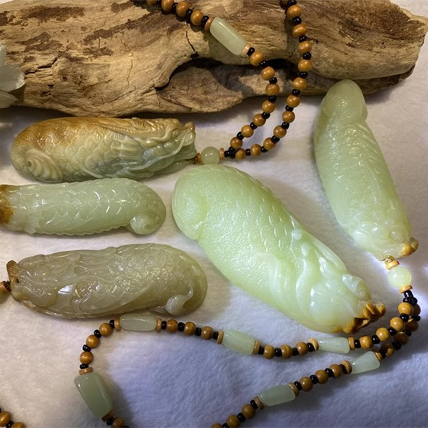 和田玉黄白河磨玉鱼化龙龙鱼手把件手镯手串吊坠原石籽料析木河磨