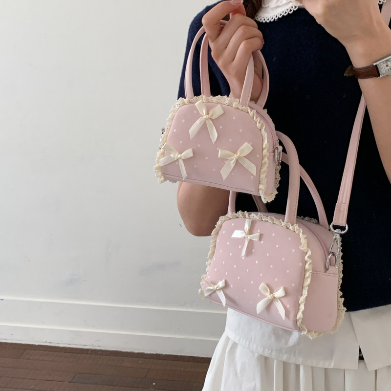 女童手拎包小公主软萌蝴蝶结洋气蕾丝花边斜挎包儿童宝宝出游小包