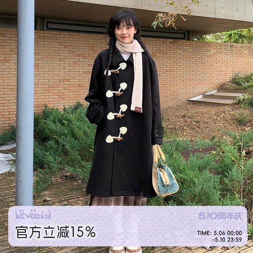 斜门襟黑色牛角扣呢大衣