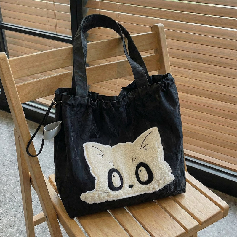 秋冬大容量包包女2025新款百搭休闲单肩包可爱猫咪抽绳通勤托特包