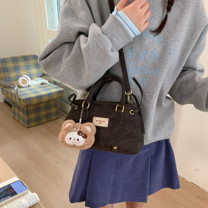 美拉德复古手提保龄球包包女2026新款大容量简约单肩斜挎包枕头包