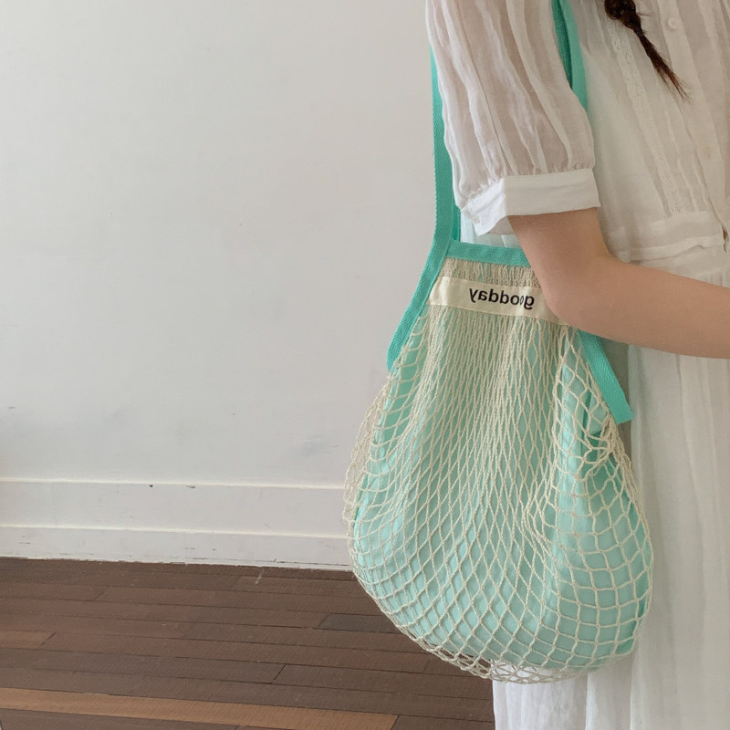 韩国小众设计网眼镂空手提编织包女2026新款休闲单肩包沙滩网兜包