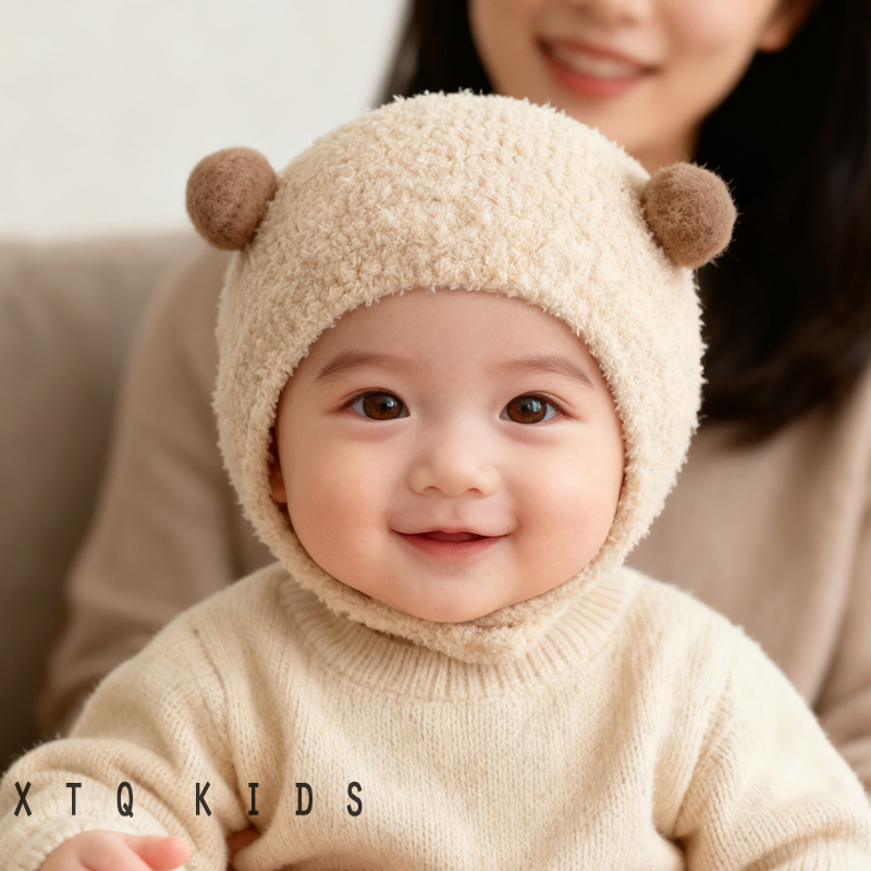 婴儿帽子秋冬2025新款毛绒帽男女宝宝超萌球球套头包耳帽纯色护耳