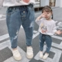 Quần jeans bé gái 2019 xuân hè mới bé ngoại ngoại lỏng lẻo quần cũ bé bé lỗ halon quần thủy triều - Quần jean quần áo trẻ em 10 tuổi