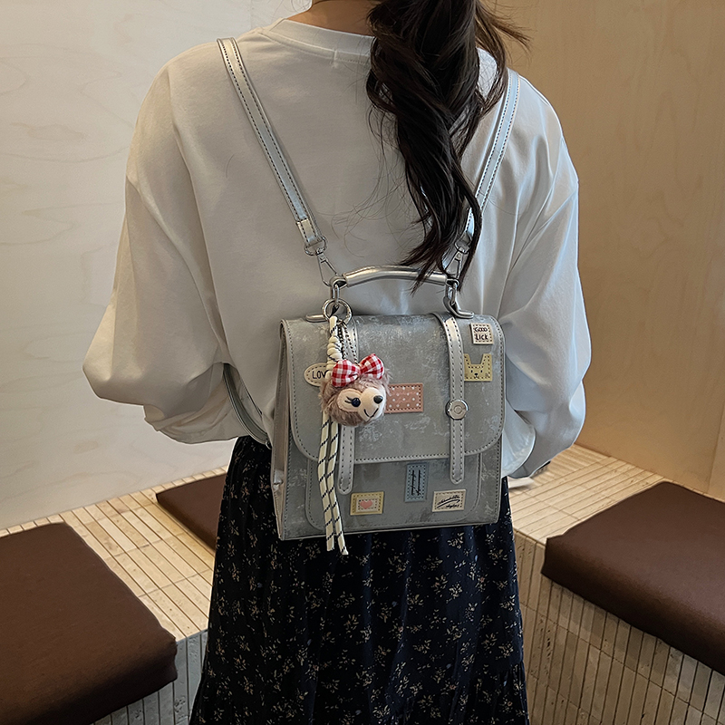 学院风徽章装饰双肩包女2025新款手提包小背包多功能女包斜挎包女